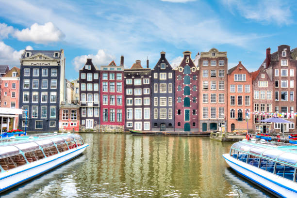 istock Amsterdam architecture and Damrak canal, Netherlands 1017818924