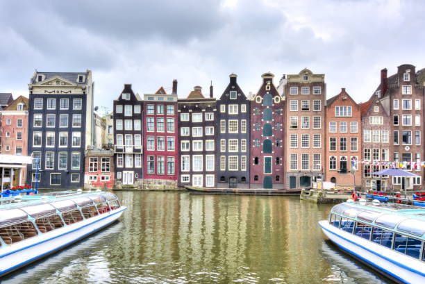 istock Amsterdam architecture and Damrak canal, Netherlands 1017818938