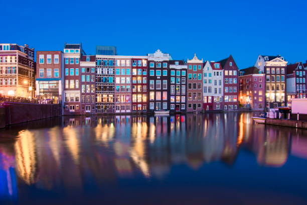 istock Damrak canal at night, Amsterdam, Netherlands 1017819110
