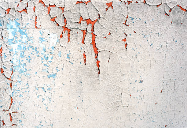 istock Old Blue White Peeling Cracked Paint and Plaster 1017827304