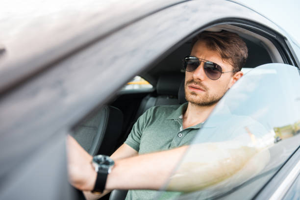 istock Man driving in his car 1017833972