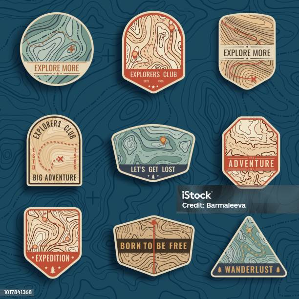 Set Of Nine Topographic Map Travel Emblems Outdoor Adventure Emblems Badges And Logo Patches Forest Camp Labels In Vintage Style Map Pattern With Mountain Texture And Grid Stock Illustration - Download Image Now