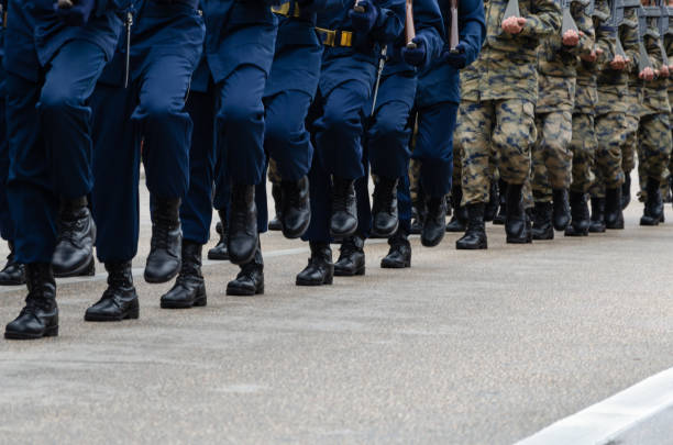 istock Soldiers marching on street during parade 1017845338