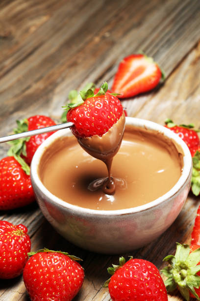 istock Fondue with Melting chocolate or melted chocolate and strawberry. 1017850452