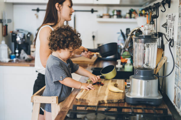 istock Mother and toddler boy cooking 1017877008