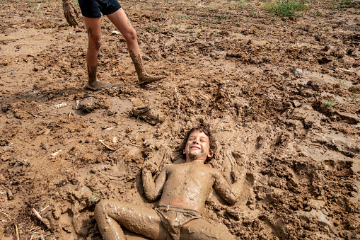 Little boy playing in mudLittle boy playing in mudLittle boy playing in mudLittle boy playing in mud