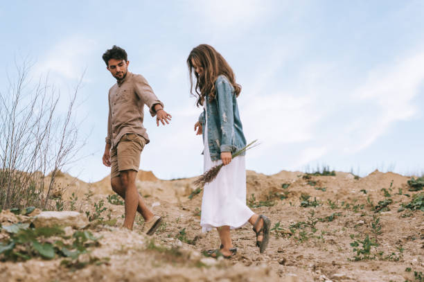 istock handsome stylish man walking with beautiful girlfriend 1017898726