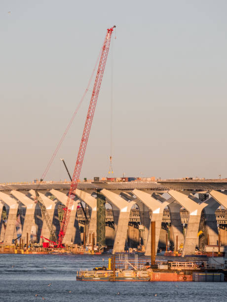 istock Major bridge construction site at the golden hour, Montreal, quebec, Canada. 1017900896