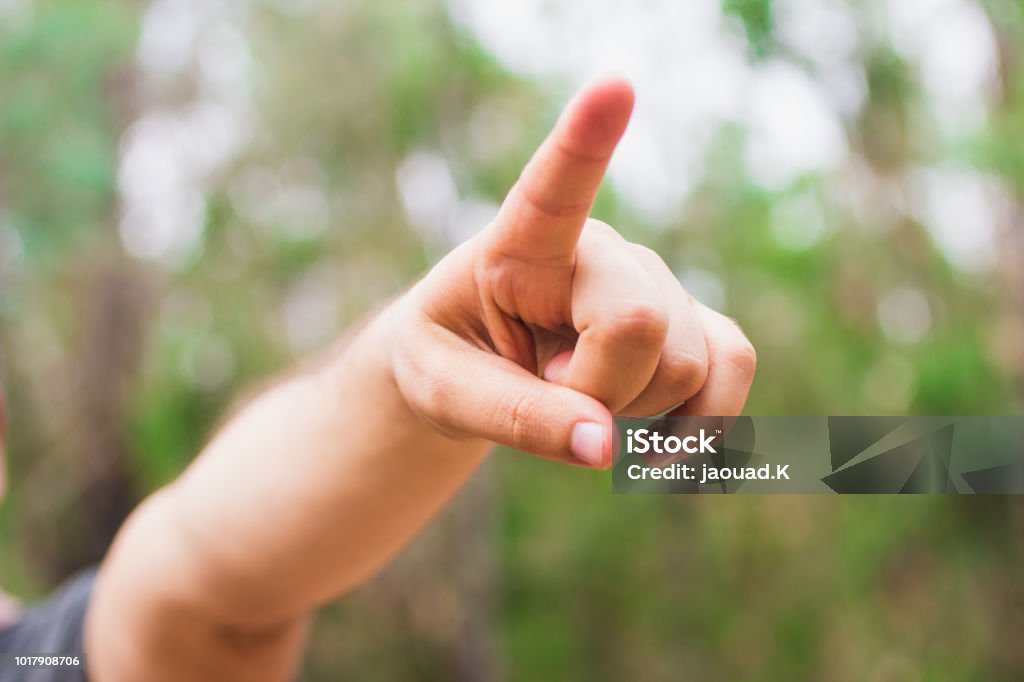 Caucasian male adult hand pointing with finger to the camera and to you, hand sign, positive and confident gesture from the front Adult Stock Photo