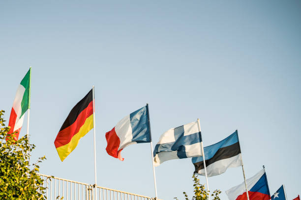istock multi national flags of different countries against the blue sky 1017958866