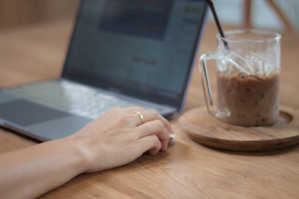 istock Woman working on computer in coffee shop 1017968816
