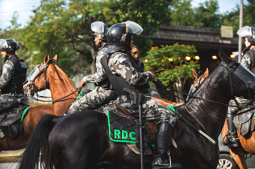 Recife, Pernambuco, Brazil - August 12, 2018: Brazilian Police Officer working on horseback in Recife city.