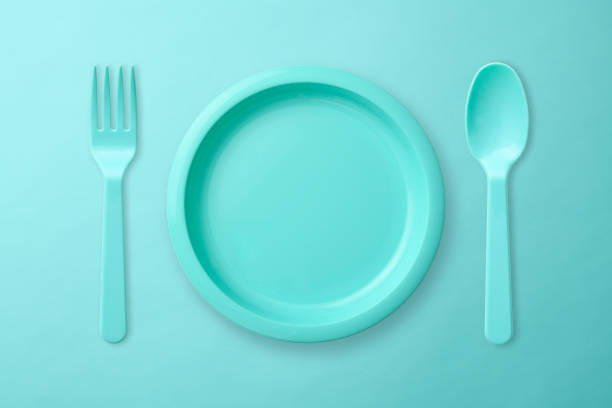 istock Blue plastic plate, Folk, and spoon on blue background 1017981484
