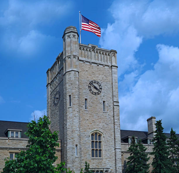 istock stone clock tower with American flag 1017981820