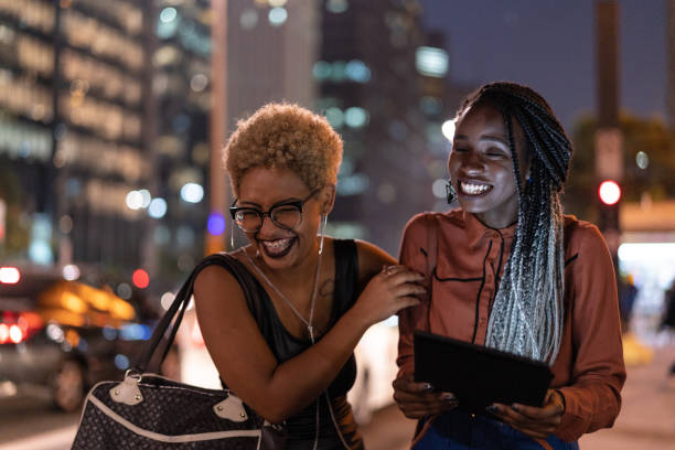 Two Woman Walking at night and having fun