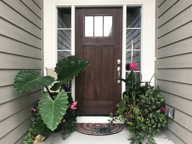 istock Front Door Tropical Pink and Green Plants 1017986754