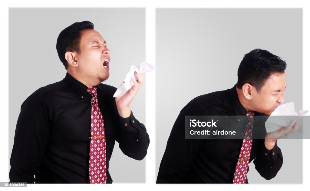 Young Asian Businessman Sneeze Portrait of young Asian businessman sneeze, business people sick of flu disease Business Stock Photo