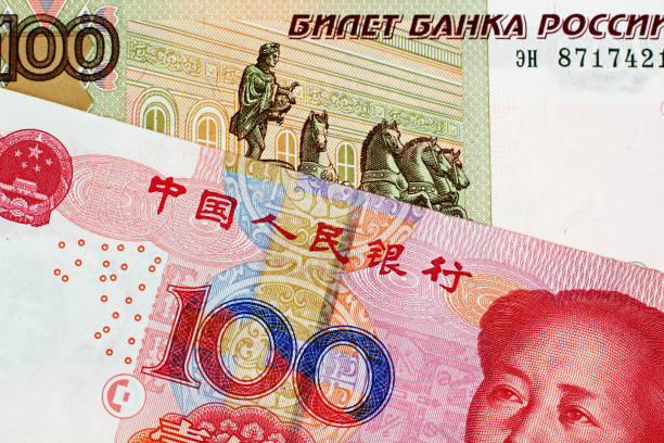 istock Chinese 100 Yuan Bank Note With 100 Russian Ruble bank note 1018011162