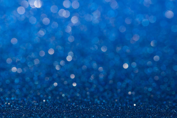 istock Abstract blue sparkling glitter wall and floor perspective background studio with blur bokeh.luxury holiday backdrop mock up for display of product.holiday festive greeting card. 1018011494
