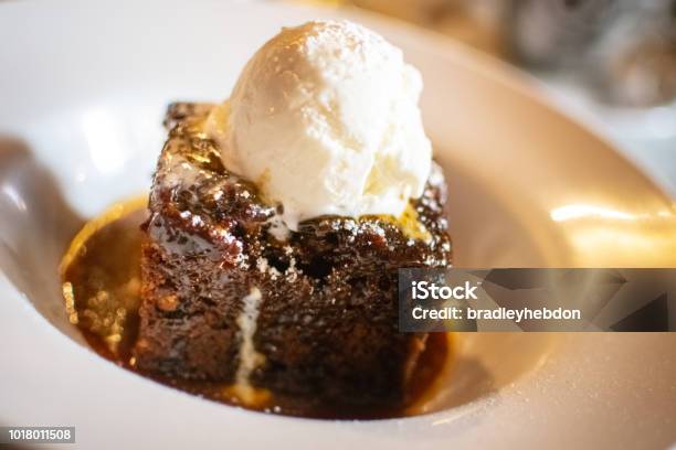 Sticky Toffee Pudding Served With Icecream Stock Photo - Download Image Now - Mousse - Dessert, Sticky, Toffee