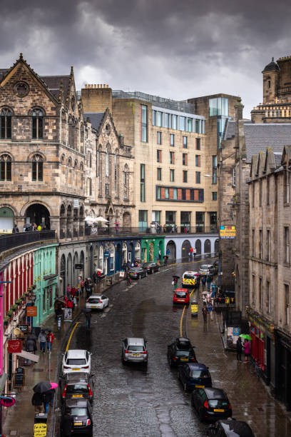 Victoria Street in Edinburgh, Scotland Victoria Street in the Old Town has to be one of the most photographed locations in Edinburgh. Its gentle curve and colorful shopfronts make it a favorite spot for tourist photos, postcards and TV commercials. high street shops stock pictures, royalty-free photos & images