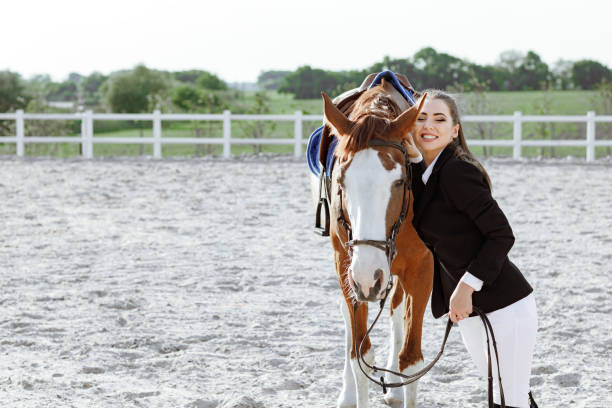 istock Rider elegant woman riding her horse outside 1018027770
