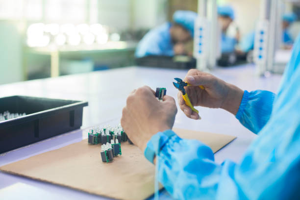 istock Workers with diode in uniform at a LED lighting factory in Dongguan, China 1018041060