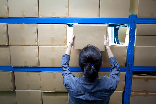 Woman doing the inventory at a warehouse