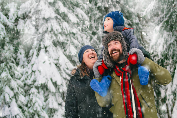 family in a winter walk - family winter walking fun imagens e fotografias de stock