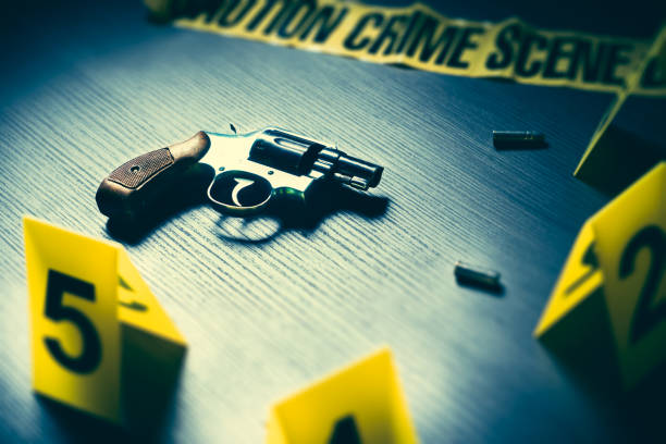 istock Crime scene with gun and evidence markers 1018048140
