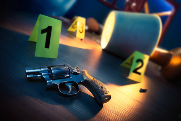istock Crime scene with gun and evidence markers 1018048200