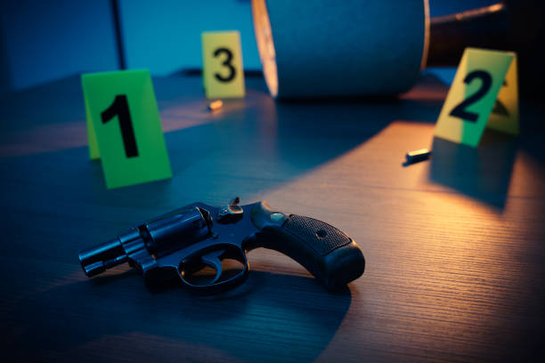 istock Crime scene with gun and evidence markers 1018050926