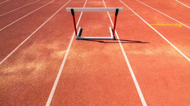 istock hurdle race barrier on red  running track 1018053152