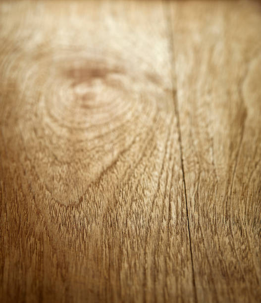 istock light faded closeup wood angled background 1018053396