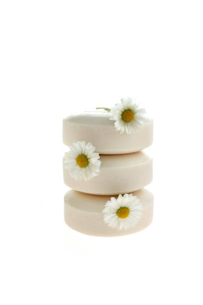istock Chamomile soap. White soap with chamomile extract on white background. Organic Natural Cosmetics 1018056194