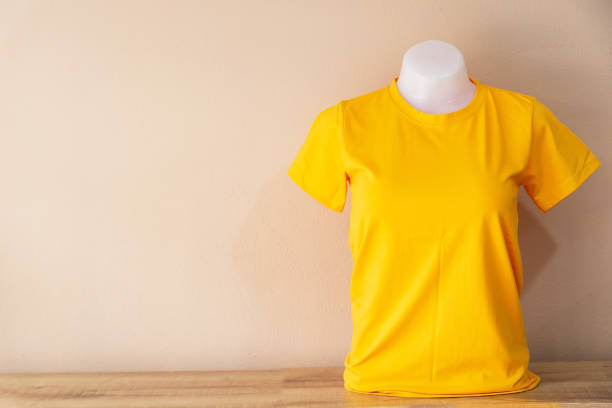 istock Yellow T-Shirt isolated on a Pastel color background 1018056428
