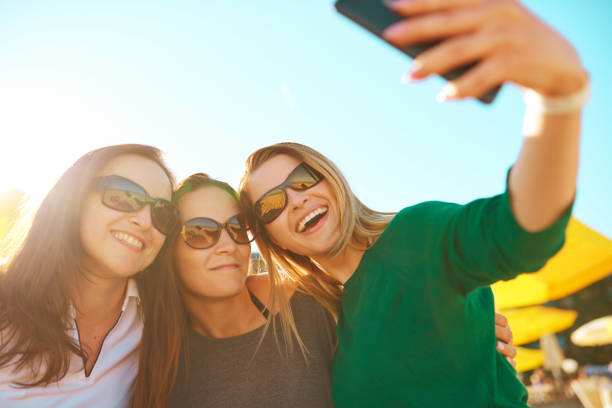 istock joyful friends in summer time 1018058918