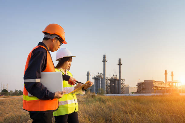 istock Construction manager and engineer woman working near power plant 1018062090