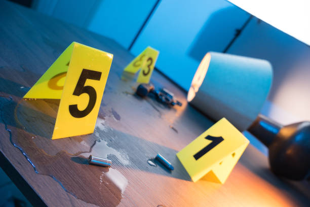 istock Crime scene with gun and evidence markers 1018062138