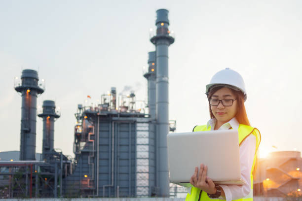 istock Asia woman engineer working with tablet PC near power plant 1018062164