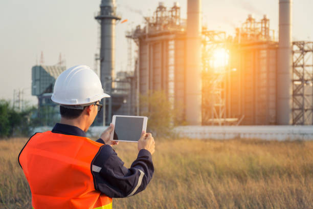 istock Engineer working with tablet PC near power plant 1018062542