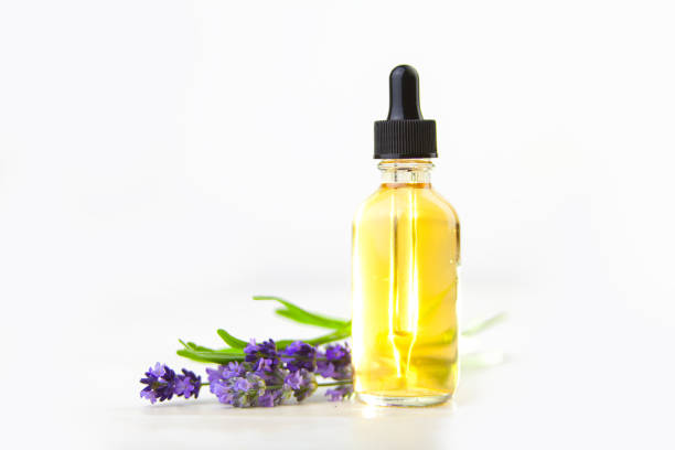 istock lavender essential oil in  beautiful bottle on White background 1018067068