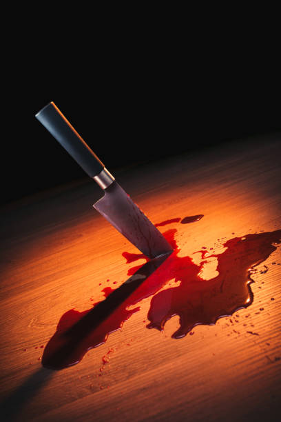 Bloody crime scene with knife on the floor