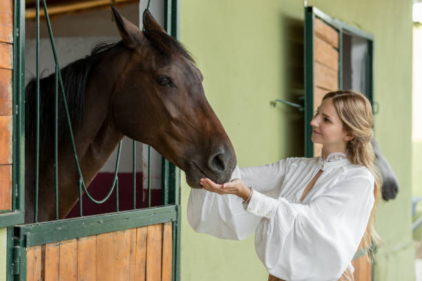 istock Woman with horse 1018072786