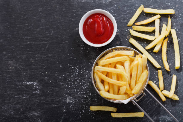 istock French fries with ketchup on dark table 1018072906