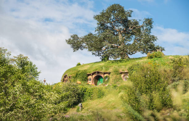 The Bag End an iconic famous Hobbiton holes (Bilbo & Frodo house) in Hobbiton movie set in Matamata, New Zealand. Matamata, New Zealand - December 09 2017 : The Bag End an iconic famous Hobbiton holes (Bilbo & Frodo house) in Hobbiton movie set in Matamata, New Zealand. matamata new zealand stock pictures, royalty-free photos & images