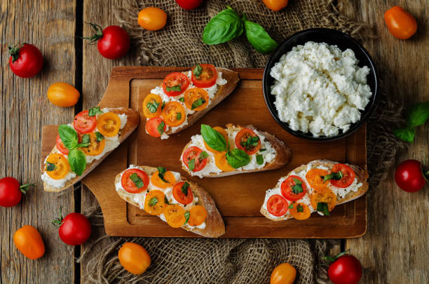 istock Ricotta tomato Basil bruschetta with fresh tomatoes and Basil leaves 1018078654