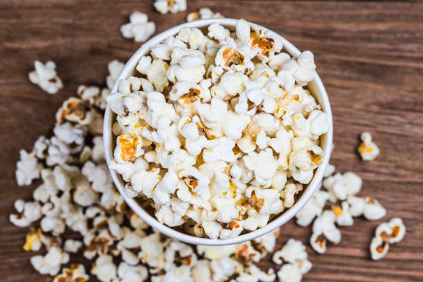 istock Salt popcorn on the wooden table, 1018081840