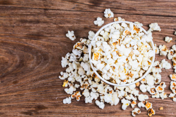 istock Salt popcorn on the wooden table, 1018081844