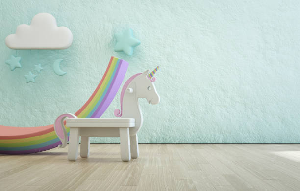 licorne blanche jouet sur plancher en bois de chambre d’enfant avec fond de mur de texture rugueuse vide de béton bleu. - playground cute baby blue photos et images de collection